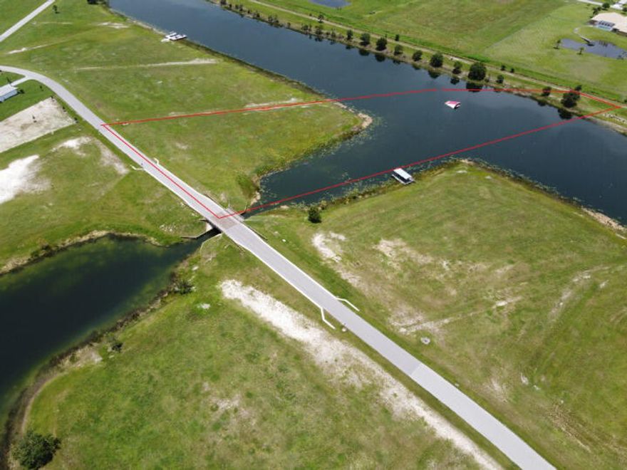 Lakefront Lot #5 at Pentalago in Palm City.   Roughly 2 acres upland and 3 acres submerged.   Only  five lots remain in Phase One.   A residential lake community designed for tournament water skiing.  5 interconnected lakes with 42 lakefront lots.   Upland varies, average upland is 3+/-acres with 2+/- acres of water. (5 Acres total) Where living means every day is summer...Pentalago is where you want to live. Only 42 home sites are being offered in this private, gated community planned for South Florida.Five interconnected lakes will make Pentalago a water sports jewel along the Treasure Coast - a place where living means every day truly is summer.Pentalago has 212 acres of Florida sunshine and crystal-clear, freshwater lakes. Located in unspoiled Martin County, Pentalago pla...