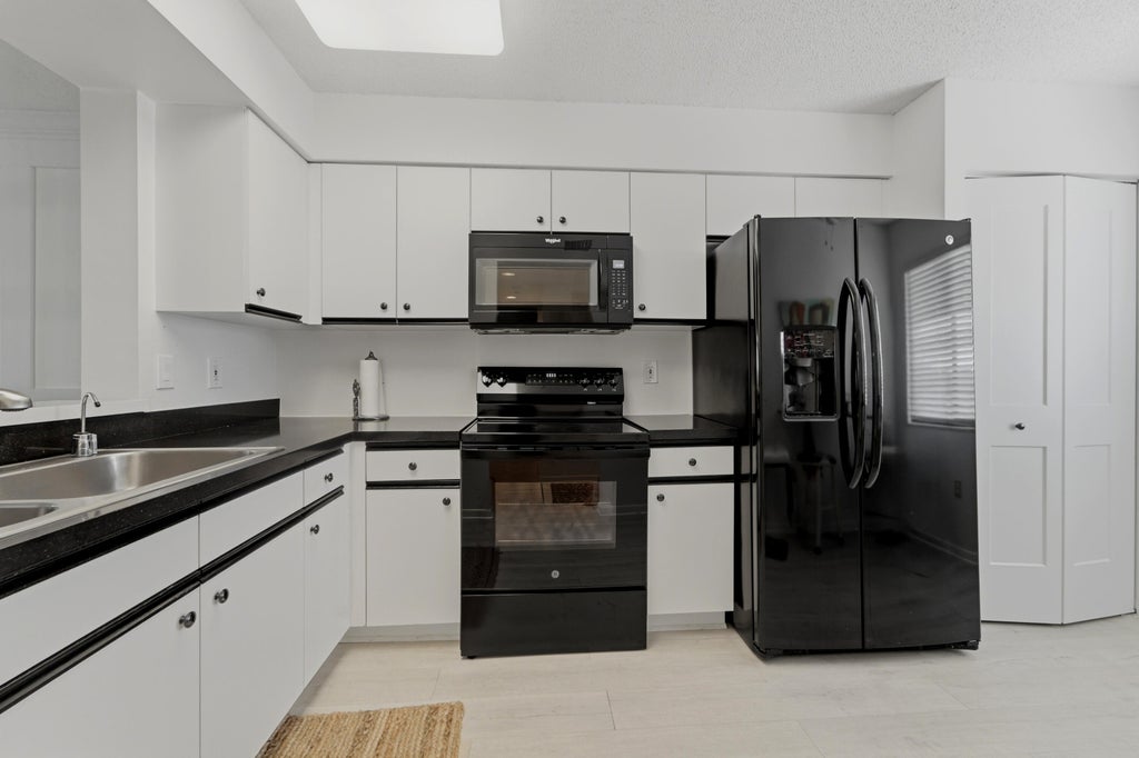 Photo of 6149 Pointe Regal Circle #403, Delray Beach, FL 33484 (MLS # B26059501)