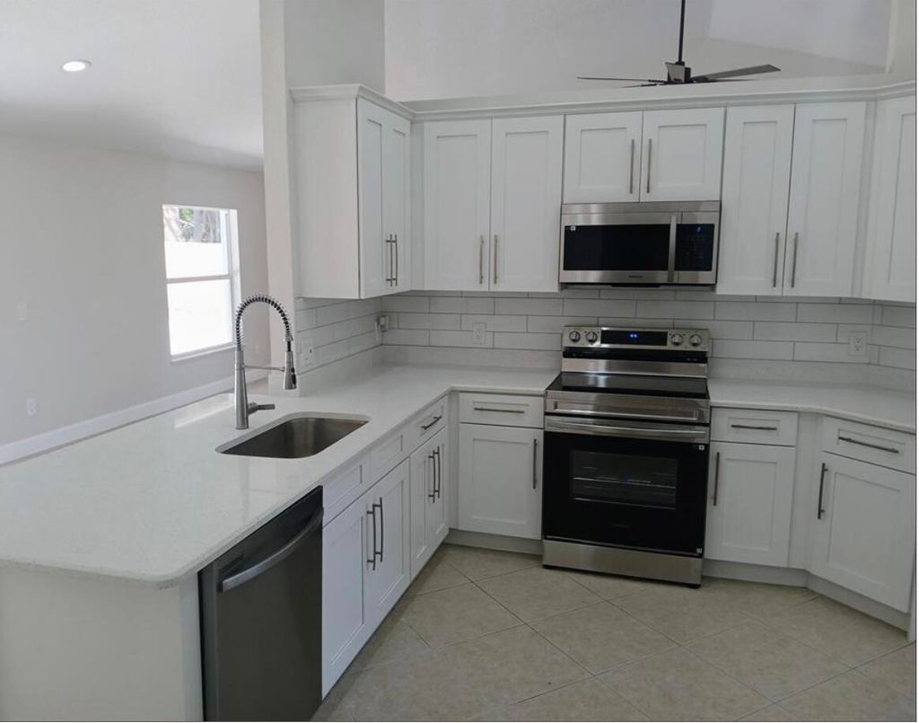 Photo of 3450 SW Martin Avenue, Port Saint Lucie, FL 34953 (MLS # B26001582)