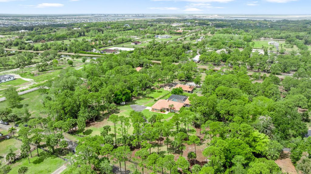 Photo of 2559 Palm Deer Drive, Loxahatchee, FL 33470 (MLS # B26013870)