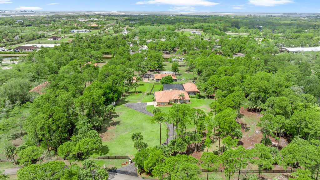 Photo of 2559 Palm Deer Drive, Loxahatchee, FL 33470 (MLS # B26013870)