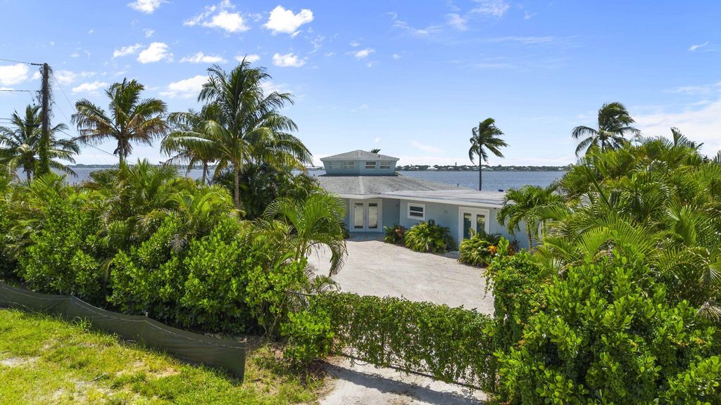 Photo of 993 NE Orange Avenue, Jensen Beach, FL 34957 (MLS # R10952751)