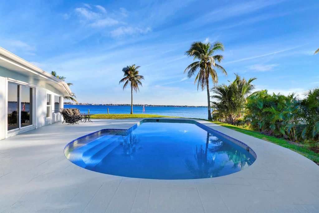 Photo of 993 NE Orange Avenue, Jensen Beach, FL 34957 (MLS # R10952751)