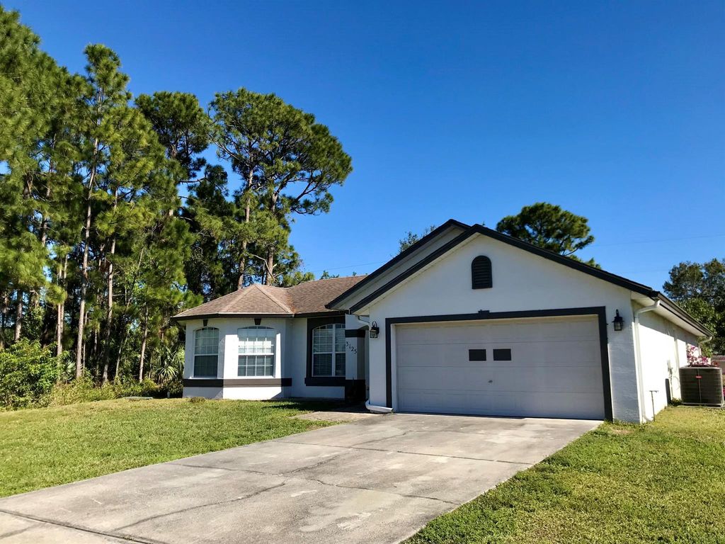 Photo of 3125 SW Crenshaw Street, Port Saint Lucie, FL 34953 (MLS # R11050860)