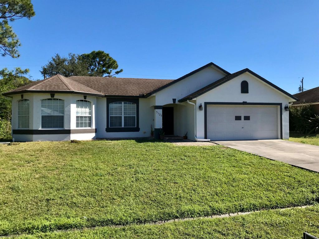 Photo of 3125 SW Crenshaw Street, Port Saint Lucie, FL 34953 (MLS # R11050860)