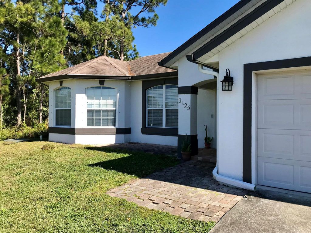 Photo of 3125 SW Crenshaw Street, Port Saint Lucie, FL 34953 (MLS # R11050860)