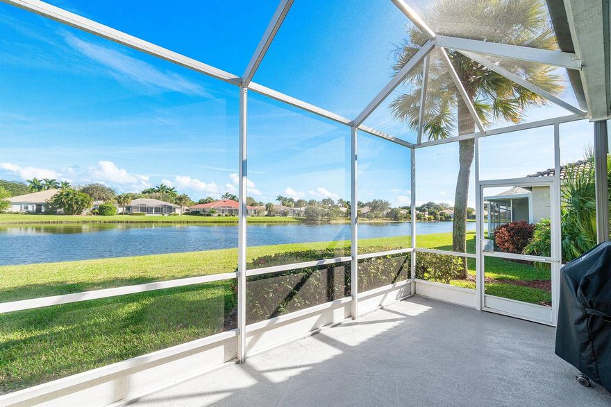 Stunning fully renovated and truly MOVE-IN READY 3BR/2BA waterfront villa in Majestic Isles! This beautifully appointed 3-bedroom, 2 bath waterfront villa was FULLY renovated in 2021 and offers modern elegance, quality craftsmanship, and serene water views. The designer open concept kitchen features a large quartz island, countertops, glass tile full backsplash, top of the line Samsung stainless steel appliances (2021), a built in wine fridge w/quartz counter, white cabinetry, pots & pans drawers, pantry, and luxury contemporary finishes. Gorgeous porcelain tile flooring flows throughout the home, complemented by all new contemporary baseboards and door trim.  LED lighting on dimmers that creates a warm and inviting ambiance.  Open floorplan makes this home ideal for entertaining!