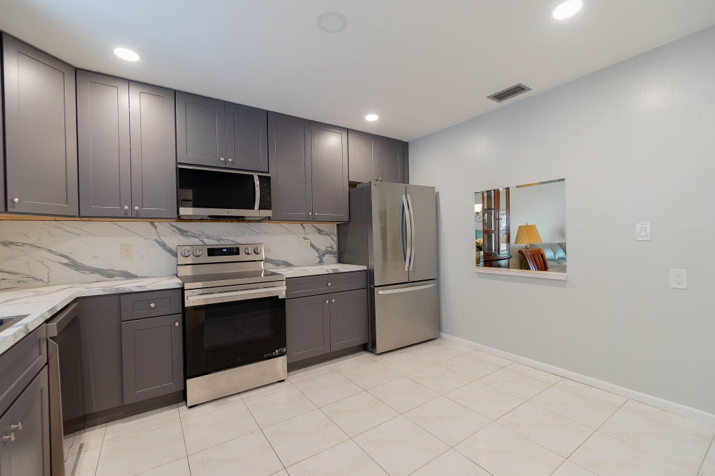Photo of 903 Worcester Lane, Lake Worth, FL 33467 (MLS # B26083358)