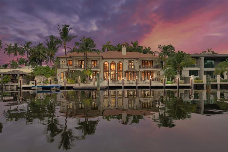 Spectacular estate encompassing nearly 8,000 sq. ft. 120' of DEEP WATER dockage on wide canal, boat lift, tiled concrete dock. Las Olas' best isle & waterway, underground utilities. Impeccable craftsmanship - Venetian Plaster, custom paint/moldings, gold leaf accents, coffered ceilings, inlaid marble floors. Stately 2 story fireplace in living room w/floor to ceiling windows. Exquisite chandeliers & frescoes/custom lighting and vaulted ceilings throughout. Beautiful master w/ His & Her baths/closets plus enormous bonus closet off master, oversized balconies. VIP guest suites w/ balconies. Expansive fully equipped chef's kitchen. 3 car garage, office, custom pool w/ spa, backyard garden and pond. This unique offering is pristine in every way & a pleasure to show!