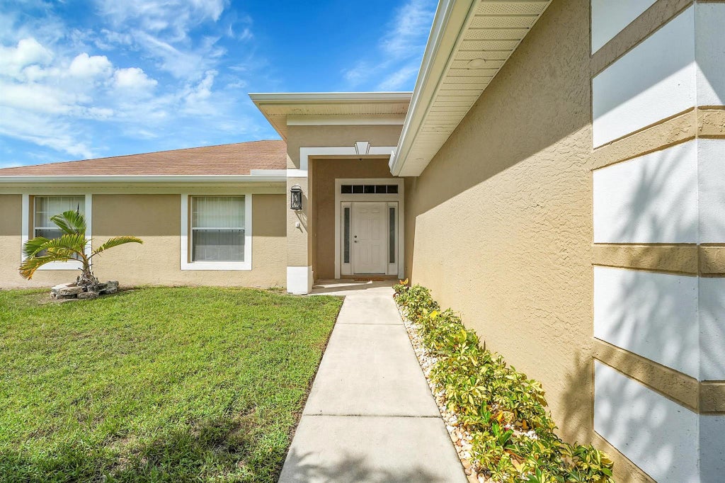Photo of 886 SE Proctor Lane, Port Saint Lucie, FL 34983 (MLS # F10528350)