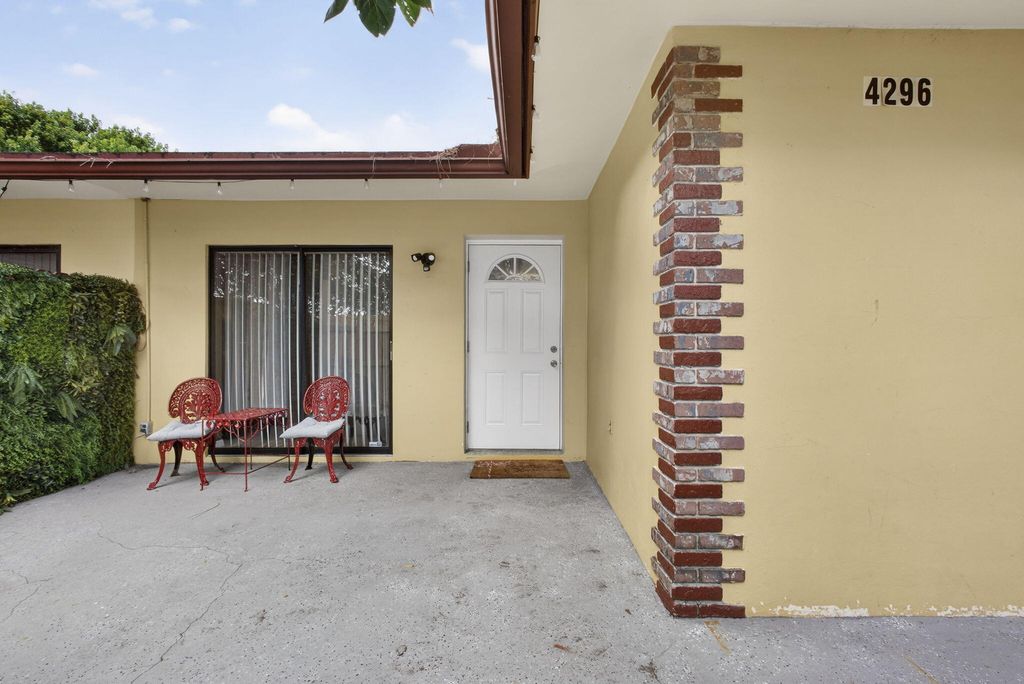 Photo of 4296 Woodstock Drive #D, West Palm Beach, FL 33409 (MLS # B26000496)
