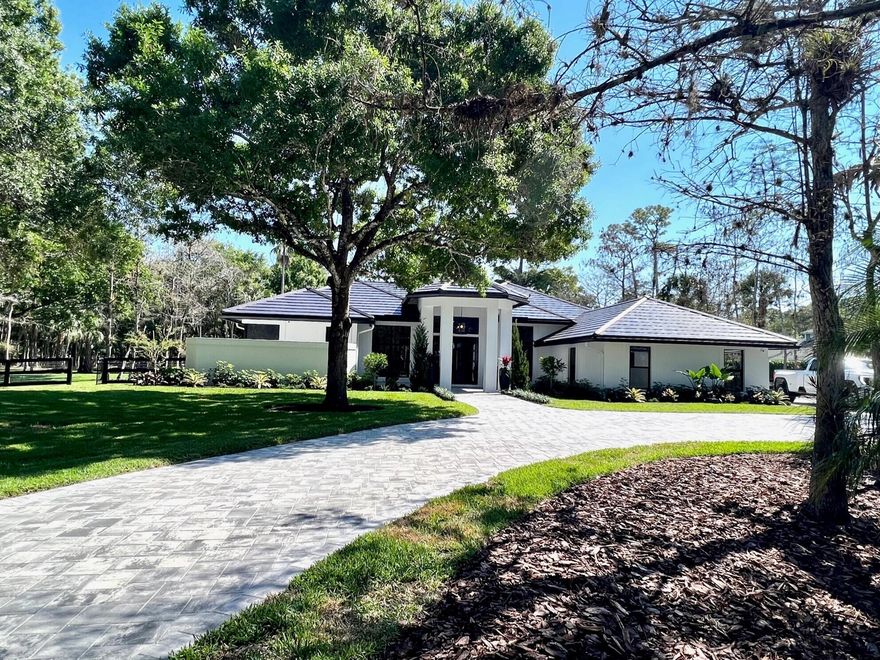 Totally remodeled home on 2 acres, new roof, new floors, new bathrooms, new pool, new kitchen ,, new fixtures, new everything !Complete Impact glass and doors , House should be  completed around the end of February with the highest finishes.  Thermador appliances, built in Miele coffee maker, Illuminated Kitchen counter. Luxury bathrooms, stunning wood floors, New 45 foot pool with spa. New AC unit New water system, New landscaping and sprinkler system .  Modern open floor plan. This house is spectacular!!  Barn and equestrian amenities can be added. Dont miss this beautiful home