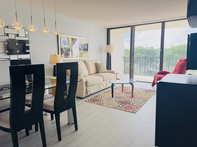 Annual 1 Bed/1-Bath Rental in the heart of West Palm Beach! Welcome to your beautifully renovated oasis being offered fully-furnished turn key or the owner can remove all. Step inside to discover brand-new vinyl flooring throughout, a stylishly remodeled bathroom, and a contemporary kitchen featuring granite countertops and stainless steel appliances.The open living space flows effortlessly to a covered private balcony, that can be accessed from the bedroom and living room ideal for relaxing or enjoying morning coffee. Located in a well-maintained community with resort-style amenities, including a heated saltwater pool overlooking scenic Lake Mangonia, fitness center, clubhouse, and BBQ area surrounded by lush tropical landscaping. Close to shopping, Tanger Outlets, Super Target, Palm