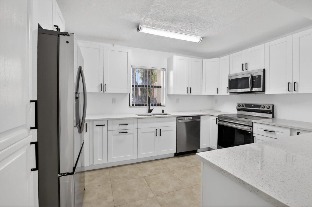Photo of 11556 NW 1ST Street, Plantation, FL 33325 (MLS # B26067479)