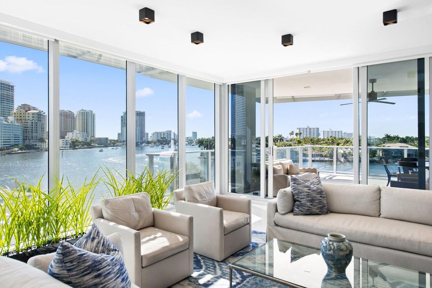 Discover the epitome of luxury living in this stunning 3-bed, 3.5-bath SW corner residence at Adagio, featuring a desirable split floor plan, fresh paint, soaring ceilings, and floor-to-ceiling glass showcasing breathtaking 180-degree views. Step into your private elevator foyer and enjoy a thoughtfully designed layout where each bedroom has an ensuite bath for ultimate privacy, including a master suite facing the Intracoastal with serene water views, a spa-like bathroom, and dual walk-in closets. The open-concept living/dining areas seamlessly connect to the gourmet kitchen with state-of-the-art Gaggenau appliances, a gas cooktop, wine cooler, sleek custom cabinetry, a lanai-style east terrace, and  west outdoor kitchen. Enjoy resort-style amenities: 2 pools, fitness center and lounge.