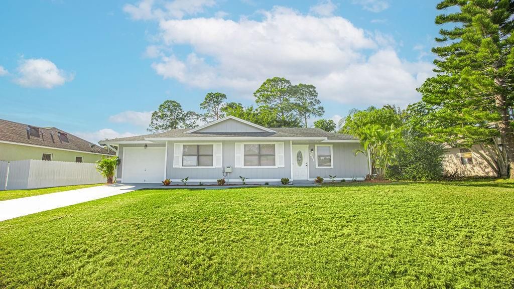Photo of 1041 SW Longfellow Road, Port Saint Lucie, FL 34953 (MLS # F10411304)