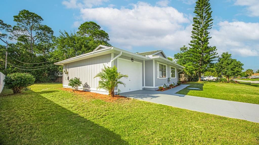 Photo of 1041 SW Longfellow Road, Port Saint Lucie, FL 34953 (MLS # F10411304)