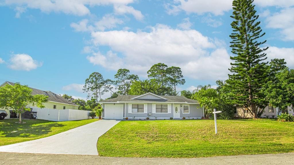 Photo of 1041 SW Longfellow Road, Port Saint Lucie, FL 34953 (MLS # F10411304)