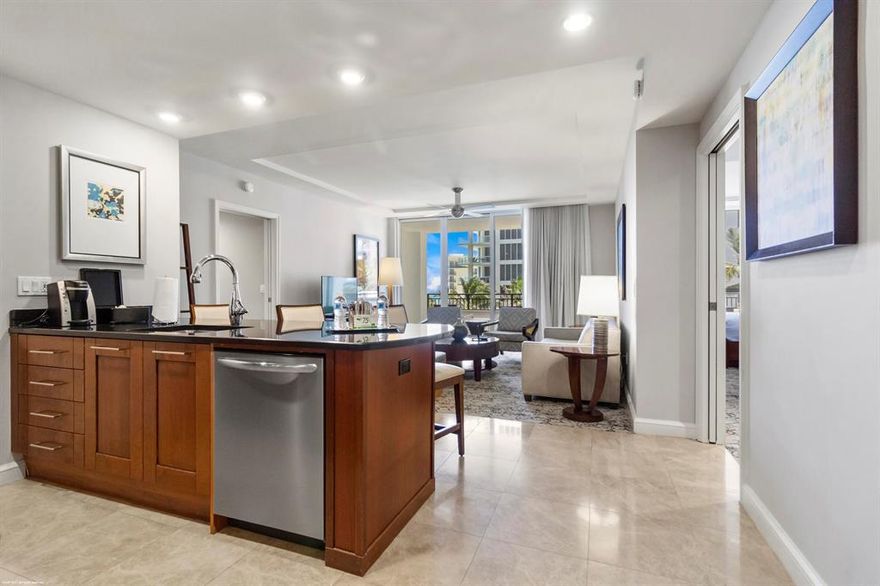 Fabulous oceanfront luxury resort living with all of the amenities without the high price! 2 bedroom, 2 bath, 1,234 s.f. oceanfront suite with sunny Southeastern views with extra large terrace. Wonderful family/pet friendly vacation retreat, relaxing & rejuvenating getaway or investment property on beautiful and unique Singer Island. Eligible for the hotel's optional owner's rental program. Featuring 239 all-suite resort units and 66 residential condominiums, the resort includes 4,000 square feet of meeting space, an 8,500-square foot spa, and all of the amenities and services one would expect from a world-class facility. The hotel condo residence has recently become very popular because it offers a multitude of uses - it can be a family "place on the beach," a personal time retreat from a busy life or a getaway destination that can be used as a corporate benefit. Butler Service, valet attendants, and a full-time concierge will enrich guest experiences and activities, including coordination of private events, theater tickets, dinner reservations, and travel arrangements.

Experience the essence of elegance in one or two bedroom resort units ranging from 800 square feet to just over 2,100 square feet of living space. Decorated with dark wood tones, stainless steel kitchen appliances, and marble baths, the resort offers a luxurious contemporary modern edge. Enjoy majestic views of the Atlantic Ocean or Intracoastal Waterways from the expansive terraces in each suite. Dining options include an alfresco ambiance at the ocean side eatery, the convenience of room service, or special events catered within the stunning entertainment veranda. Even a temperature-controlled wine room is available to store private wine collections.

The white sands of Singer Island provide the ultimate place to relax. Attentive pool and beach side attendants provide everything from plush beach towels and relaxing lounge chairs to tempting frozen libations. Outdoor private cabanas are the ideal place to enjoy a casual poolside lunch.