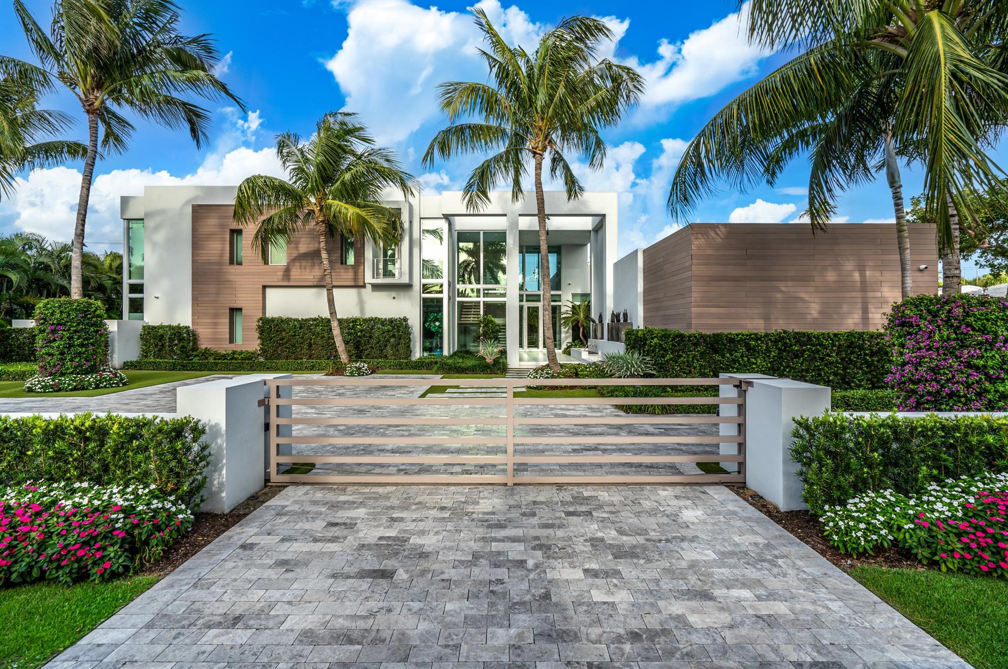 Buyer pays title insurance, Florida documentary stamps, and all other closing costs.A striking architectural statement, this modern showplace encased in glass window walls seamlessly blends indoor and outdoor living with the finest designer finishes. At the pinnacle of modern and luxurious, famed architect George Brewer with Signature Building Group masterfully originally created this one-of-a-kind estate. Covered in expansive window walls and innovatively designed, each room allows guests to feel enveloped in the tropical grounds that surround this artistic residence. The lavish combination of interior designer finishes and expansive outdoor living defines this residence that presides in Boca Raton's oldest, most prestigious Estate Section.