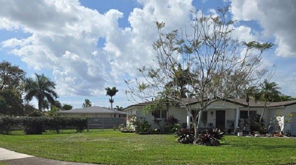 Welcome to this charming 3bedr/2bath home in the peaceful, no-HOA neighborhood of Orange Tree Lakes in Davie. With a spacious living/dining room combo and a separate family room, this home offers plenty of room to relax and entertain. The galley style kitchen features quartz countertops and stainless steel appliances, while the gas appliances: stove, tankless water heater, and dryer add efficiency and convenience. The master bedroom features a modern en-suite with a sleek shower and updated cabinets. Throughout the home, you'll find durable LVP floors that are both stylish and easy to maintain, while the bathrooms boast tile flooring. New roof and gutters installed in Feb 2025. Impact windows and doors, plus plantation shutters, bring both style and security.