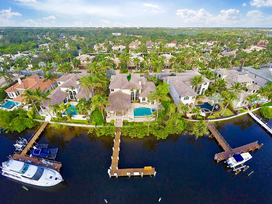 A MAGICAL LOCATION WITH THE FINEST WATERFRONT LIFESTYLE! DEEPEWATER DOCK, BRING YOUR 80' YACHT! GORGEOUS WATER VIEWS, OVERLEAST EXPOSURE,20-30 MINUTES TO PB INLET. CONTEMPORARY DESIGN WITH SMART AND ELECTRONIC FEATURES TO ADD TO YOUR COMFORT AND ENJOYMENT. MASTER ON GRD LEVEL WITH FRENCH DOORS TO PATIO, DOUBLE WATER CLOSETS, JACUZZI SPA TUB, MARBLE SHOWER, DUAL VANITIES, CUSTOM WALK-IN CLOSETS, HUGE TV, ELEC. SHADES!ALL GUEST BEDROOMS ENSUITE. HOME THEATER WITH ELEC. SHADES 110'' SCREEN, RECLINING CHAIRS,MINI KIT.AND PLAY AREA.CHEF'S KITCHEN WITH SUBZERO, DACOR 6 BURNER GAS, WALL OVEN AND MICRO. CENTER ISLAND, ALL GRANITE SURFACES, SNACK BAR, BREAKFAST AREA, ALL OVERLOOKING THE WATER. 25' CEILINGS IN LIVING ROOM, FORMAL DIN., STUDY,