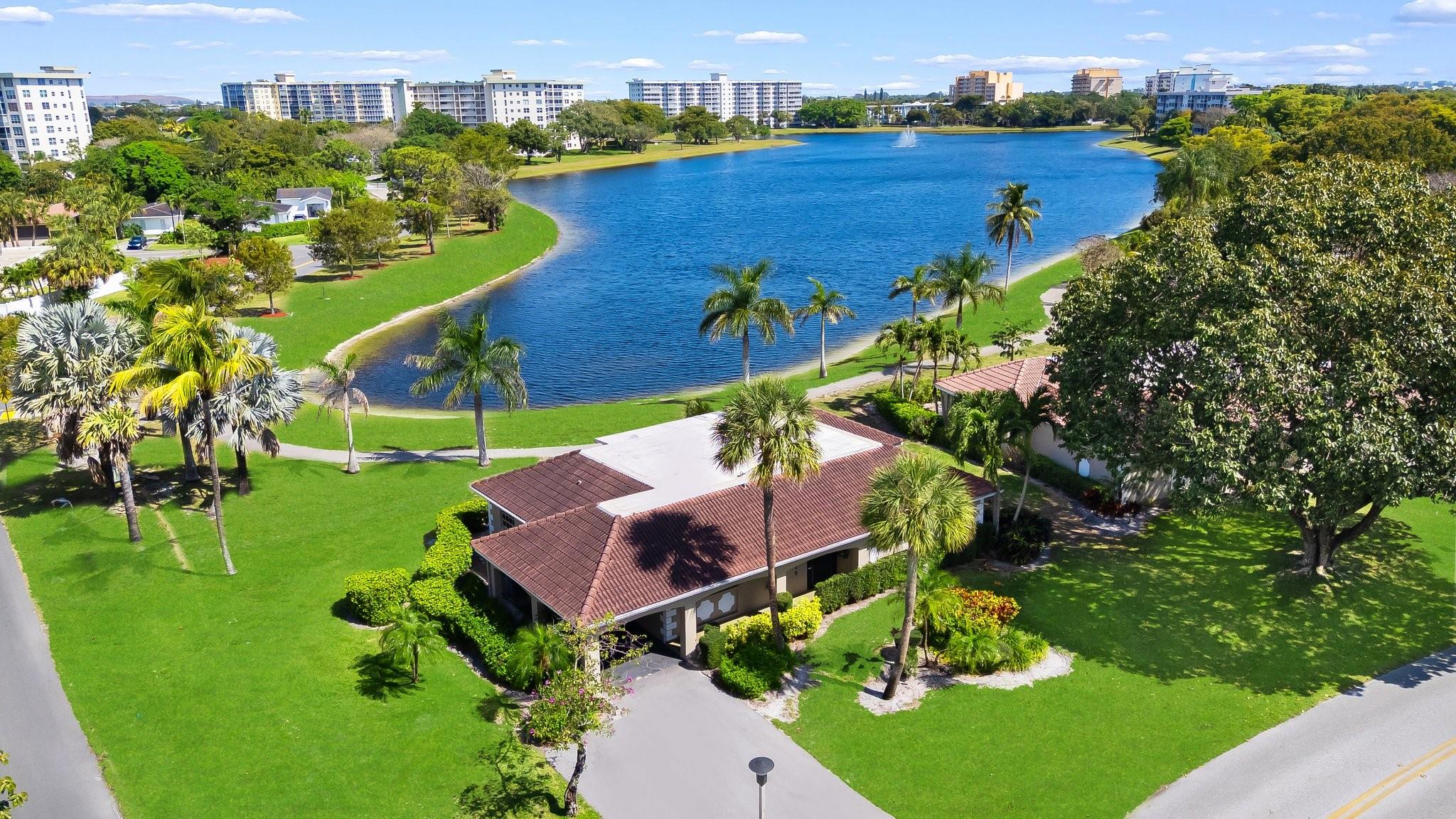 Spacious 3BR/3BA lakefront villa in Palm-Aire Country Club, available immediately for annual lease at $4,000 per month. This 2,000 sq ft home offers serene water views, a screened porch, updated kitchen with stainless appliances, and multiple living areas including a dining room and family room. Community amenities include multiple pools, golf, sauna, pickleball, basketball, BBQ areas, jogging paths, and 24/7 security. Covered parking included. Close to dining, shopping, beaches, and major highways. Move in cost: first, last, and security