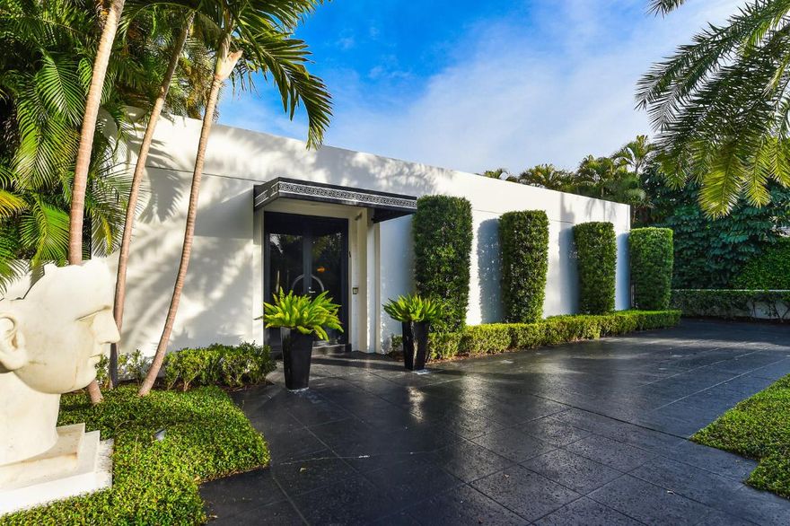 Magnificent, luxurious, elegant and private are a few of the words to describe this two bedroom Dec-modern inspired estate, conceived by Geoffrey Bradfield. The epitome of sophistication and close to Worth Avenue, it has the most impeccable design details along with a seamless free flowing floor plan, perfect for entertaining. There is an eat-in kitchen, formal dining room, living room with stainless steel fireplace, formal study, dual master baths, elevator, two car garage with storage, and a lovely pool/patio.