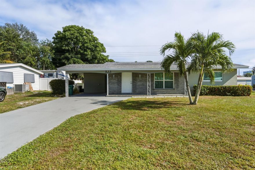 Completely renovated 2-bedroom, 2-bath CBS home in the heart of Port St. Lucie. This move-in ready residence features a brand-new kitchen with white shaker cabinetry, quartz countertops, stainless steel appliances, and an open layout perfect for everyday living and entertaining. Both bathrooms have been fully updated with modern finishes, and the home offers new flooring, fresh paint, and updated fixtures throughout.Enjoy the added flexibility of a sunroom, covered carport with storage, and a bright, functional floor plan. Conveniently located near shopping, dining, parks, and major roadways. No HOA. Home comes with a 1 year Choice Home Warranty. Choice Plan covers HVAC, electric, plumbing and appliances! See brochure in docs for details.  Roof = 2018, HVAC = 2025.