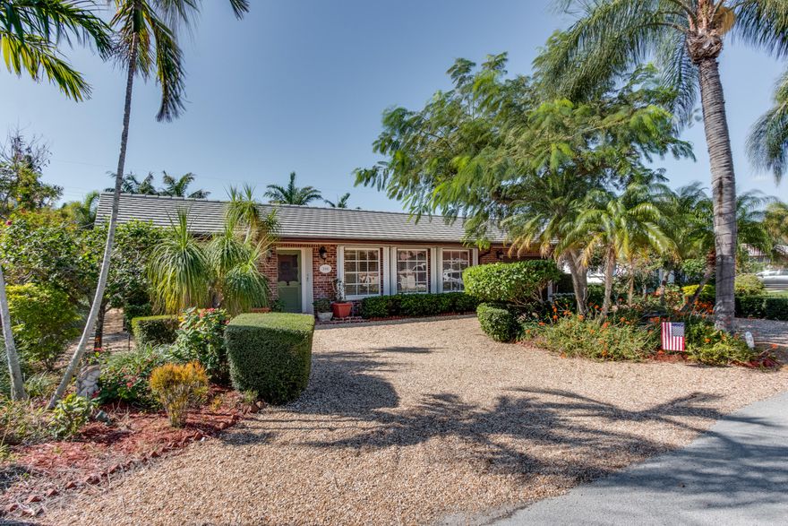 Charming CBS beach home with brick facade & slate look cement tile roof. Desirable south side of the street with river rock circular drive& 3 landscaped islands. 1793 s/f under a/c- county records incorrect. The house was a 3/2 but current owner made it a 2/2 with large master B/R & bath. Could be returned to 3/2 or possibly add 3rd  bedroom/office behind the garage 
All tropical landscaping & stone garden paths-very resort like & private w/ 8k+ of a beautiful variety of plants & self cleaning palms. Large 37 ft pool perfect for swimming!! 
Interior of the house has many upgrades-crown molding throughout, granite kitchen counters, marble bathroom vanities, plantation shutters &  custom sliding doors w/custom blinds.Great closet space. Oversized one car garage. Accordian shutters on all windows,sliding glass doors, pedestrian garage door, braced impact garage door &  front door panels. Cement tile roof & flat roof new in 2006,  American Standard a/c new in 2011,new electric hot water heater & garbage disposal in 2016, electric panel  replaced, additional attic insulation,newer high end pool pump, newer irrigation timer, electric in the front & back garden areas, 3 motion detector floodlights & all timed front exterior  lighting.  House was  painted , roof pressure washed ,&  flat roof resurfaced -all done 2016. 
Exclusions: Dining room chandelier & some  closet built ins
This home will not disappoint.  Palm Beach Shores is the best kept secret in Palm Beach County.  New underground electric planned for the town...no assessment. Check the town website for further information.
All information deemed accurate but not guaranteed. Prequal must be done by Florida Community Bank but buyer is not obligated to use them
Ask for details