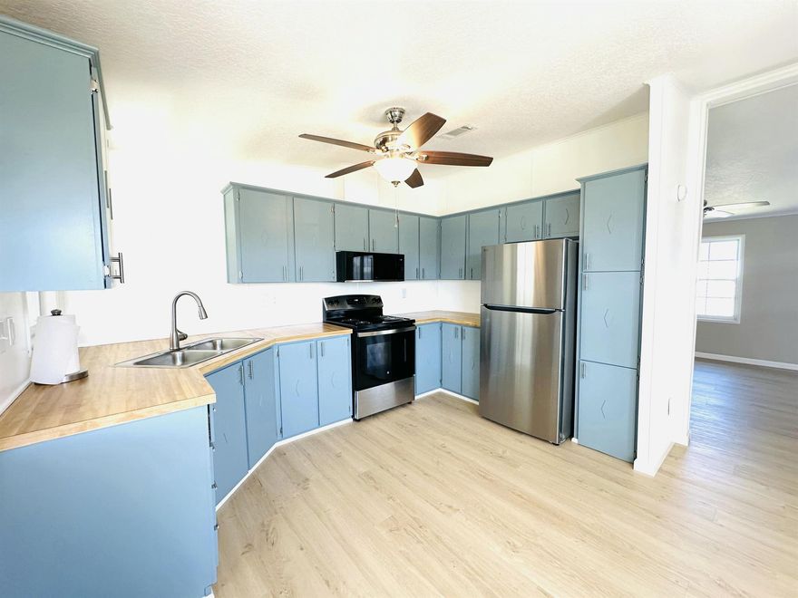 Land Owned- your winter retreat or summer getaway awaits you in the Savanna Club 55+ community. Recent updates include luxury vinyl thru/out, SS appliances, knockdown ceiling, 2025 A/C, new HWH, 2021 roof, newer windows, update tie downs and more.... home is move in ready