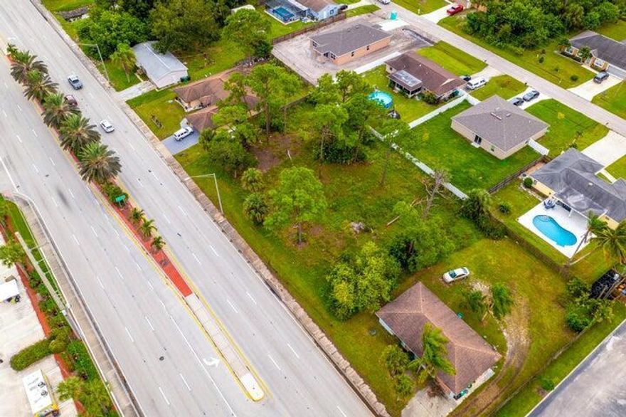 Ready to build your dream home or invest in prime real estate land? Choose one of two adjacent lots in a centrally located prime area. Easy access to main highways, like the Turnpike and I-95. Near schools, shopping, restaurants, hospitals, beaches, and parks (including Clover Park, the Mets Training Home Stadium). Great opportunity to own one lot or an option to make it a larger double lot!