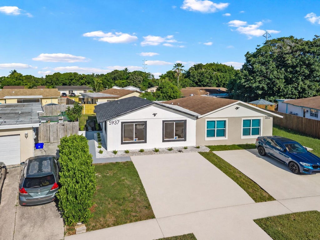 Photo of 5937 CARIBBEAN Boulevard, West Palm Beach, FL 33407 (MLS # B26065944)