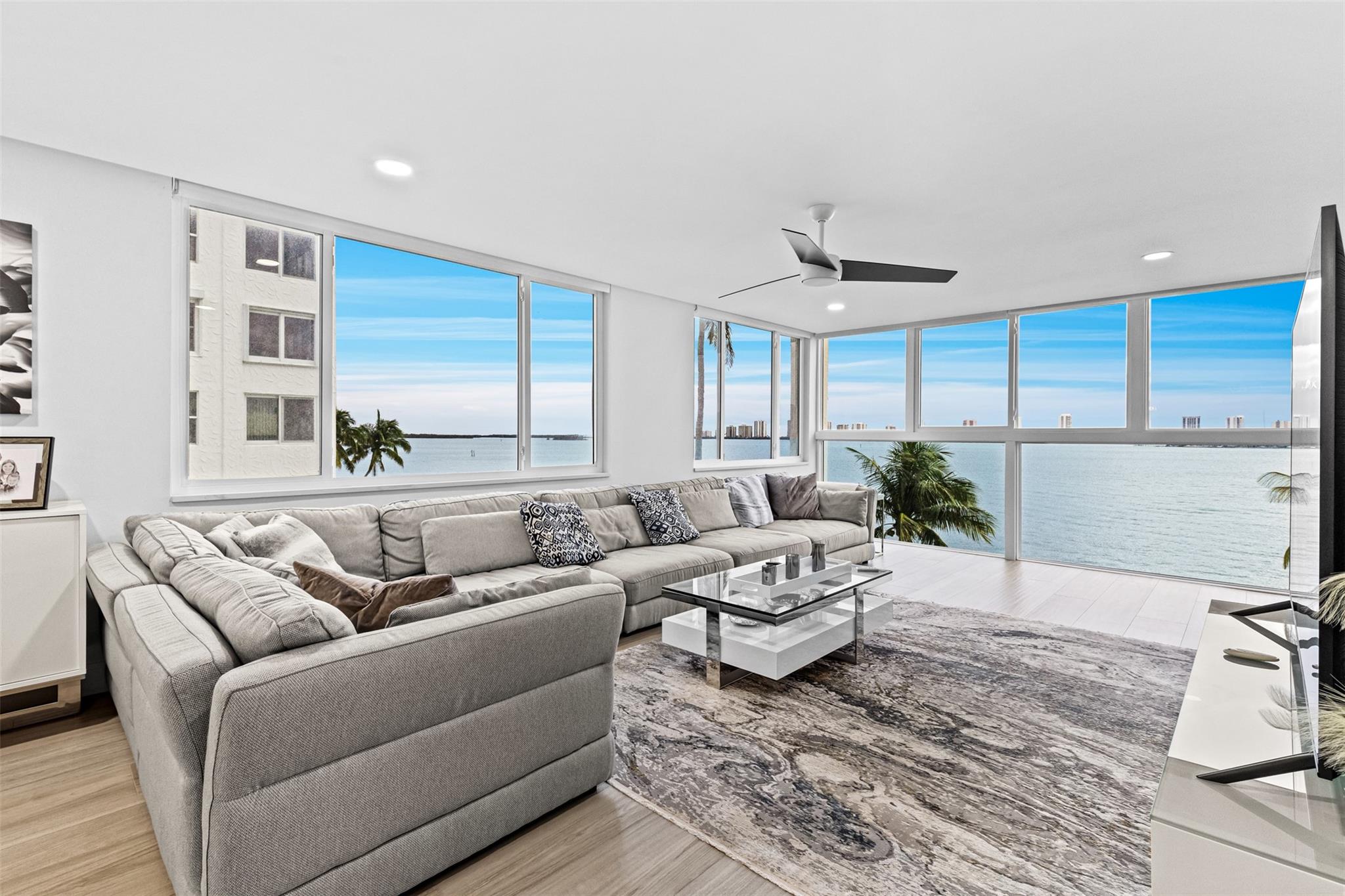 Claim your slice of paradise in this stunning, fully remodeled 2 bed/2 bath corner unit! Enjoy breathtaking panoramic views of the Intracoastal and Singer Island through new hurricane-proof windows with electric blinds. New tile flooring, walk-in closets, smart toilets, and Nest thermostat. The kitchen features a LG ceramic-glass cooktop, French door fridge, combination wall oven, and Samsung washer/dryer. In a gated community with ample parking, this unit has private storage & personal balcony space. Resort-style amenities include a pool, private walkways along the Intracoastal, shuffleboard and easy access to Lake Park Marina with boat slips, diving, fishing, and rentals. Next to the luxury Nautilus building, where units sell for $4M+, this is a rare opportunity. Furniture negotiable!
