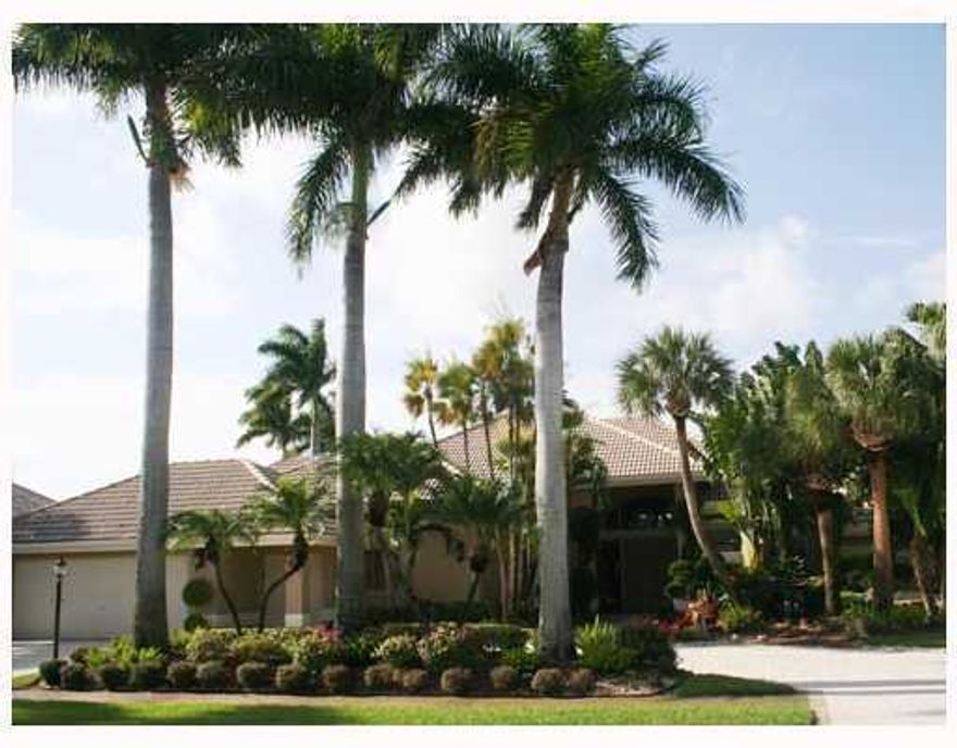 Beautifully landscape w/lake and golf vistas, koi pond with rock waterfall, 4 bedroom, entertainment media room.  Full house generator, hurricane shutters, pool heater with jandy control.  Hurricane proof garage doors.  Many built-ins.  Square footage shows larger than tax rolls due to air conditioned enclosed porch and expanded bedroom.