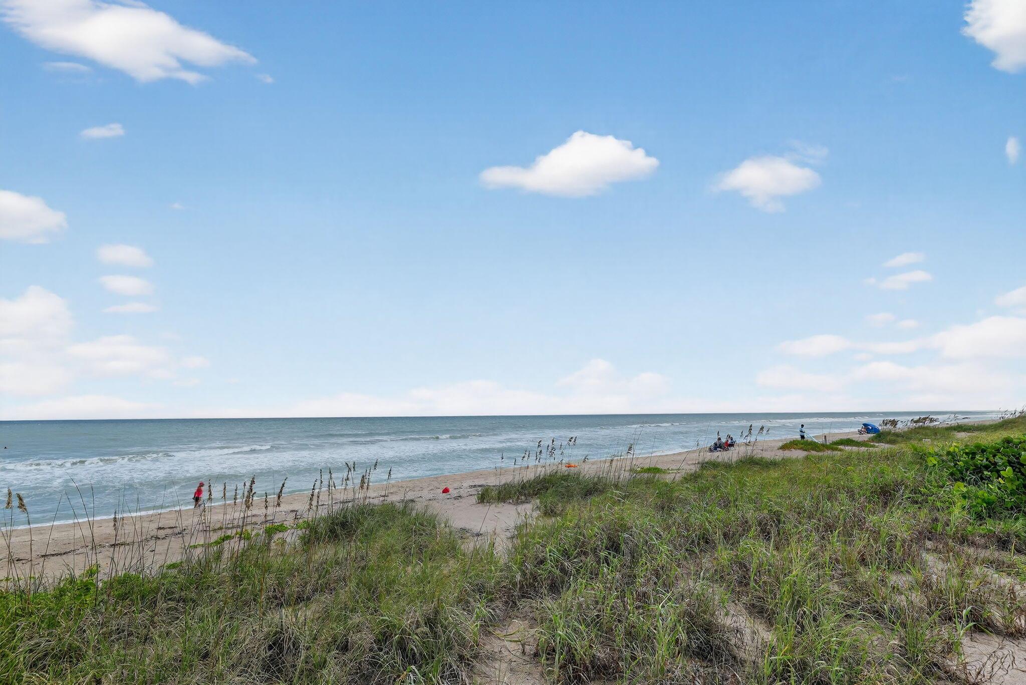 This property features a wrap-around covered balcony, perfect for enjoying those tranquil mornings or watching the sunset in the evenings. The amenities offer private ocean access, a refreshing pool, and open parking for your convenience.