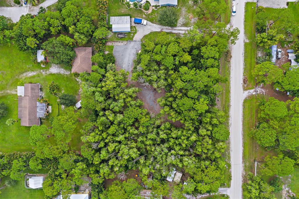 HIGH AND DRY 1.15 ACRE LOT LOCATED IN DESIRABLE COMMUNITY OF JUPITER FARMS. PARTIALLY CLEARED WITH GRAVEL DRIVEWAY. SURVEY AVAILABLE.