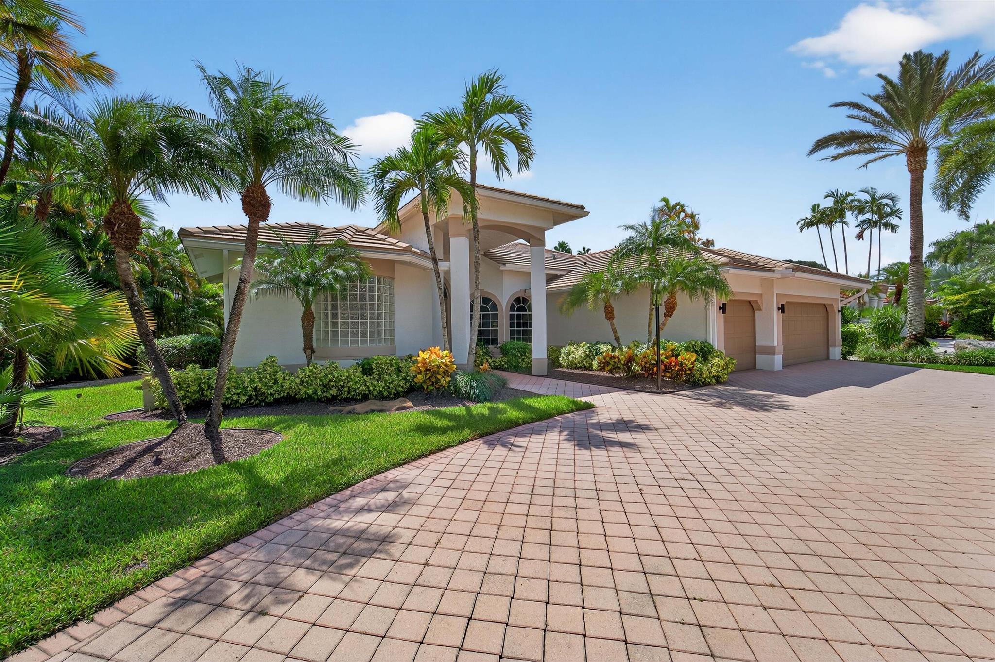 Step into your private oasis! This home is situated on an expansive 1/3-acre corner lot in the heart of Stonebridge Country Club. The stunning single-story masterpiece offers the perfect blend of luxury, privacy, and comfort. From the moment you arrive, the grand circular driveway welcomes you to a beautifully reimagined residence where every detail has been thoughtfully curated. Completely renovated from top to bottom, this 4-bedroom, 3-bath home features a show-stopping designer kitchen with top-of-the-line appliances, high-end custom cabinetry, quartz countertops, a sleek coffee bar with elegant recessed lighting throughout. Multiple spaces for relaxation include formal living room, dinning and family room. The spa-inspired bathrooms boast premium finishes and stylish touches that