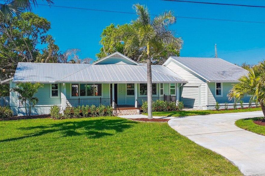 A refined coastal retreat in Stuart's coveted Port Sewall. This single level residence is set on a rare 0.64 acre homesite with no HOA. Thoughtfully renovated, the 3 bedroom, 2.5 bath layout features soaring vaulted ceilings, split floorplan, gourmet kitchen, open layout and full impact windows. The private grounds create a resort style setting with a pool, tiki hut, outdoor shower and lush tropical landscape, along with space for boat or RV storage. Moments from Sandsprit Park and the boat ramp with access to the ocean and surrounded by waterfront estates. A distinctive property defined by scale, upgrades, and a location that continues to impress. These details and more are best experienced in person.