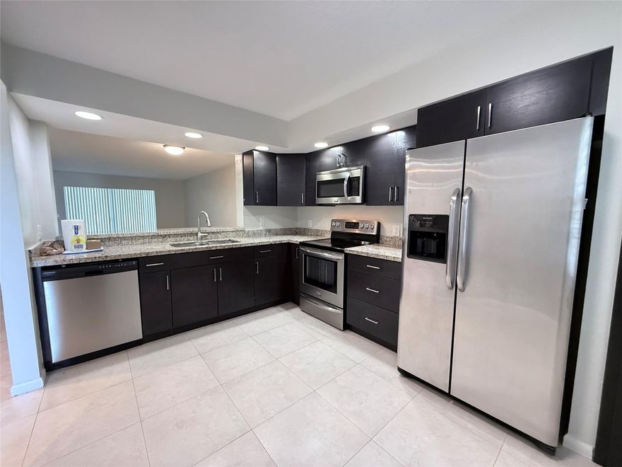 Enjoy the serene GOLF COURSE VIEW from this beautiful 2 /2 unit located on the 1st FLOOR in a 55+ community . Tile flooring throughout . Convenient WASHER & DRYER INSIDE THE UNIT. Renovated kitchen with granite counter tops and stainless steel appliances . Large walk-in closet in master bedroom, ample storage space . This charming rental features an enclosed patio perfect for relaxing and IMPACT WINDOW for your peace of mind while providing plenty of natural light. Residents can enjoy access to a multi-million-dollar clubhouse, sauna, pickle ball courts, pools, golf, complimentary transportation, and more. This condo is perfect for those seeking a vibrant and active lifestyle!