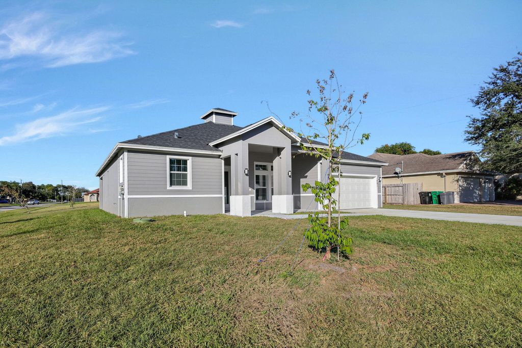 Photo of 1791 SW Effland Avenue, Port Saint Lucie, FL 34953 (MLS # R11161936)