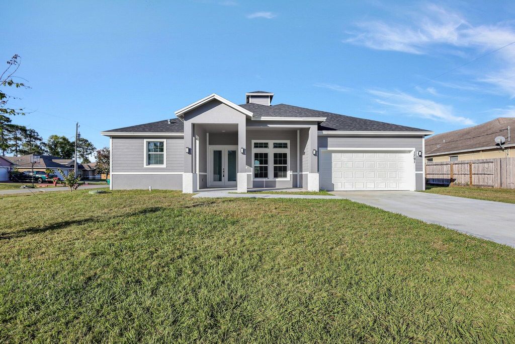 Photo of 1791 SW Effland Avenue, Port Saint Lucie, FL 34953 (MLS # R11161936)