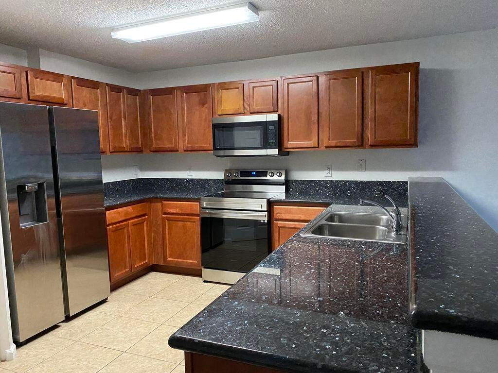 Photo of 925 Imperial Lake Road, West Palm Beach, FL 33413 (MLS # B26010487)