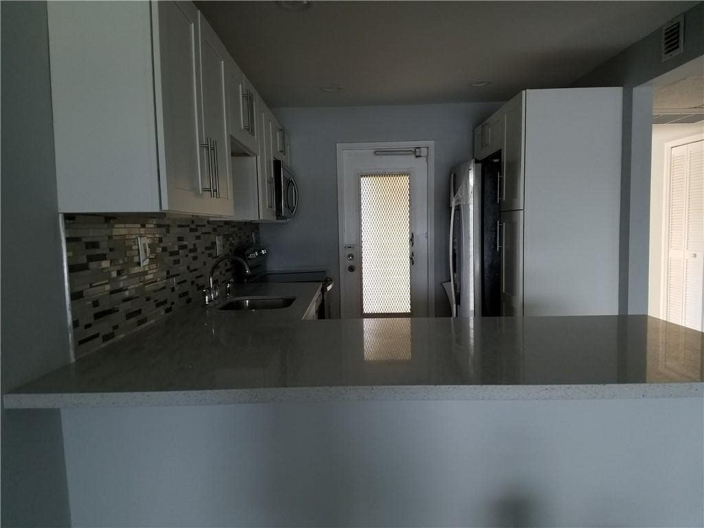 Photo of 3100 N COURSE Lane #210, Pompano Beach, FL 33069 (MLS # B26065152)