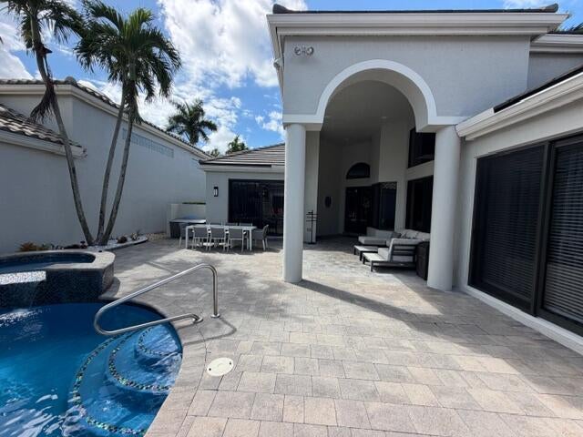 Photo of 3549 NW CLUBSIDE Circle, Boca Raton, FL 33496 (MLS # B26084162)