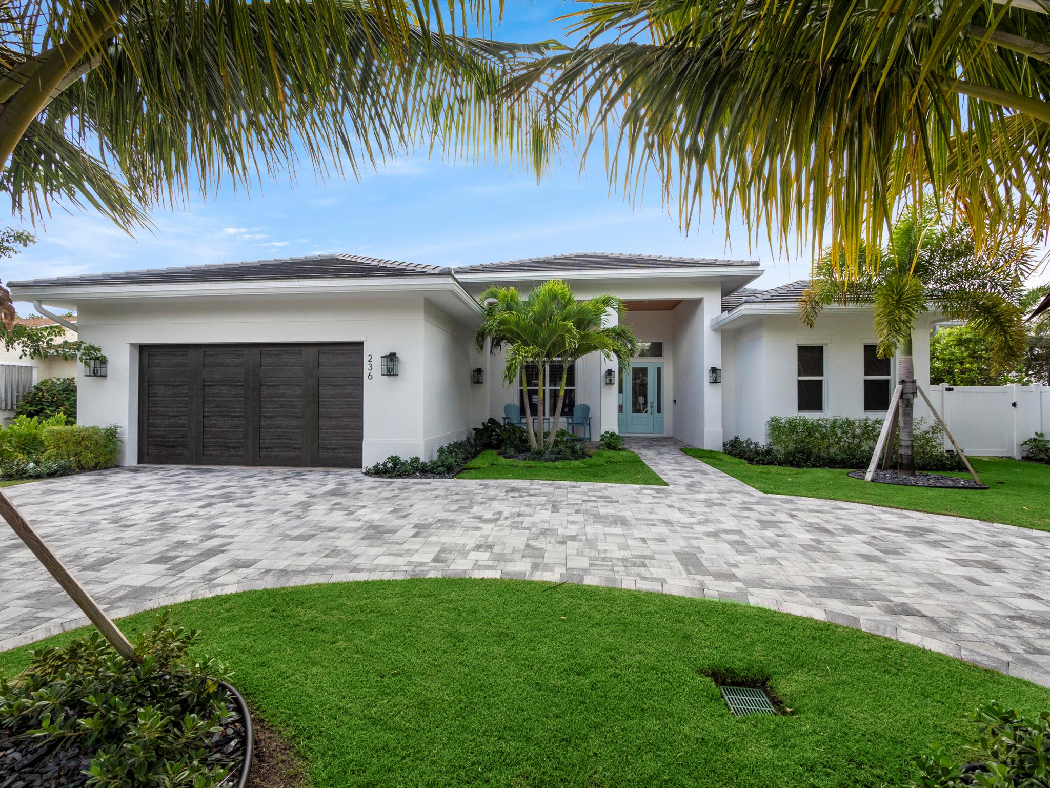 Welcome to your dream home built in 2022! This stunning home boasts solid concrete block construction, 2,692 square feet of living area, 4 bedrooms, an office and 3 full bathrooms which provides ample space for comfortable living.As you step inside, you'll be greeted by the impressive 12 and 14-foot high ceilings, creating a sense of openness and grandeur. The open concept floor plan enhances the flow of natural light throughout the house, illuminating the wood-look plank tile floors that seamlessly connect each room. The heart of this home is undoubtedly the chef's kitchen, featuring quartzite countertops, a six burner gas stove with a convenient pot filler, Thermador appliances, and a raised kitchen island.