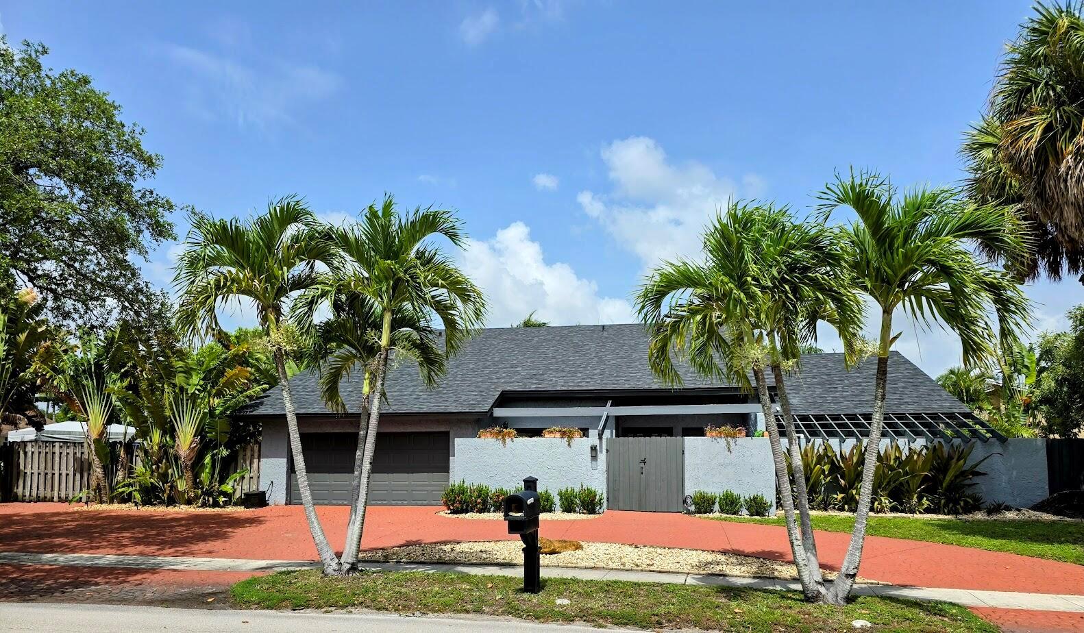 One of the kind 3300 Sq foot, 4 Bedroom 3 and half Bath home, with contemporary open floor plan located in a desirable part of Plantation, within walking distance of parks and play grounds, and fish pond at the entrance of the house, tiled throughout, on the main floor, large master Bed W/fire place, bath, and walk in closet, large formal living with fire place, and Dining area, large kitchen with dining that opens to large family room, glass sling doors all-round the house with view of private tiki and pool, second floor offers 2 oversized bedrooms with jill and jack bath with balcony overlooking the large pool with jacuzzi , and 1 oversized Bedroom with private bath, roof replaced in 22, new Ac , outlet for electric vehicle installed in garage over sized lot with room to expend yard.