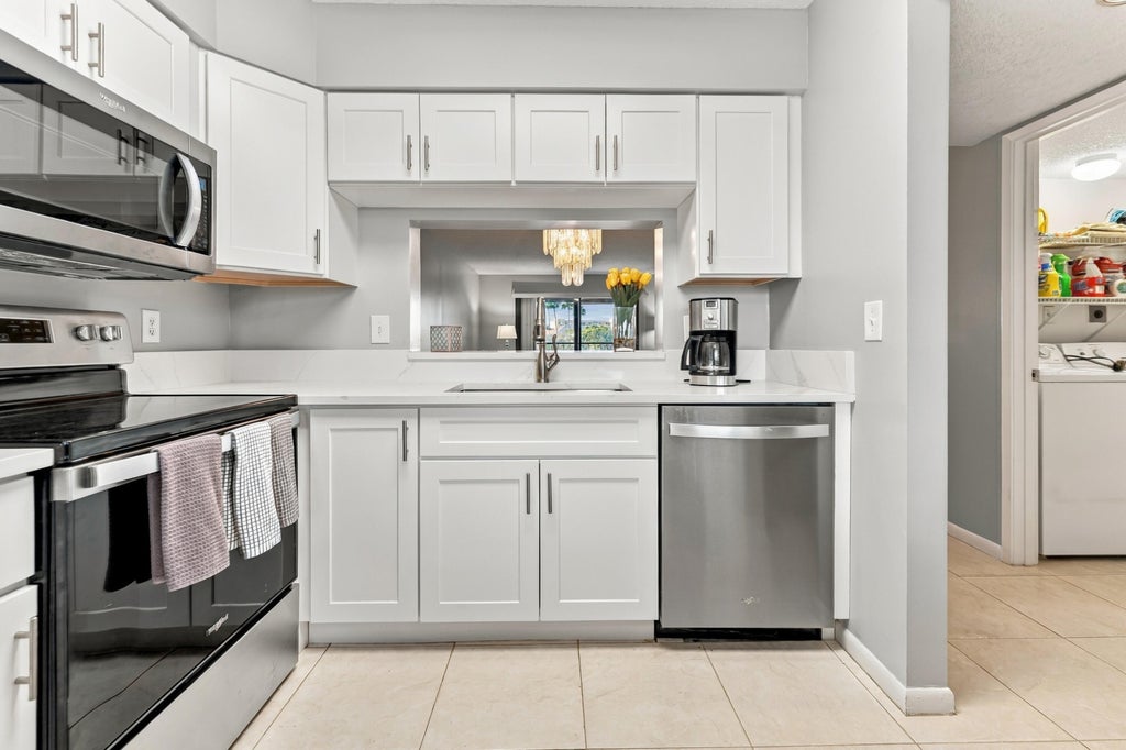 Photo of 7280 AMBERLY Lane #402, Delray Beach, FL 33446 (MLS # B26092206)