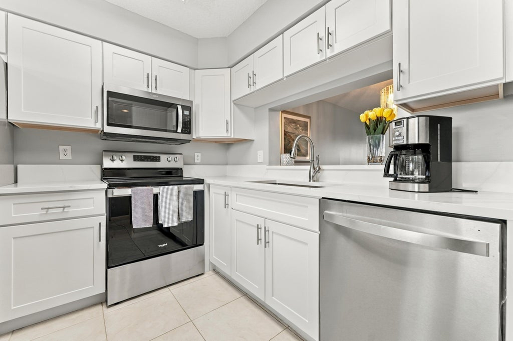 Photo of 7280 AMBERLY Lane #402, Delray Beach, FL 33446 (MLS # B26092206)