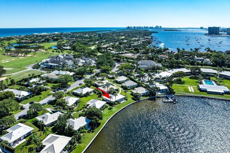 Renovated two-bedroom, two-bath golf cottage nestled along the scenic shores of Little Lake Worth in the prestigious Lost Tree Village. This luxurious residence boasts an inviting open floor plan, soaring high ceilings, walk-in closets, and a recently added storage closet for added convenience. Within easy walking distance to the main clubhouse and state-of-the-art fitness center, this property epitomizes the pinnacle of refined living in Lost Tree Village.